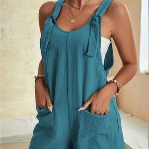 NWOT Blue Sleeveless Jumpsuit with Adjustable Straps and Wide-Leg Design